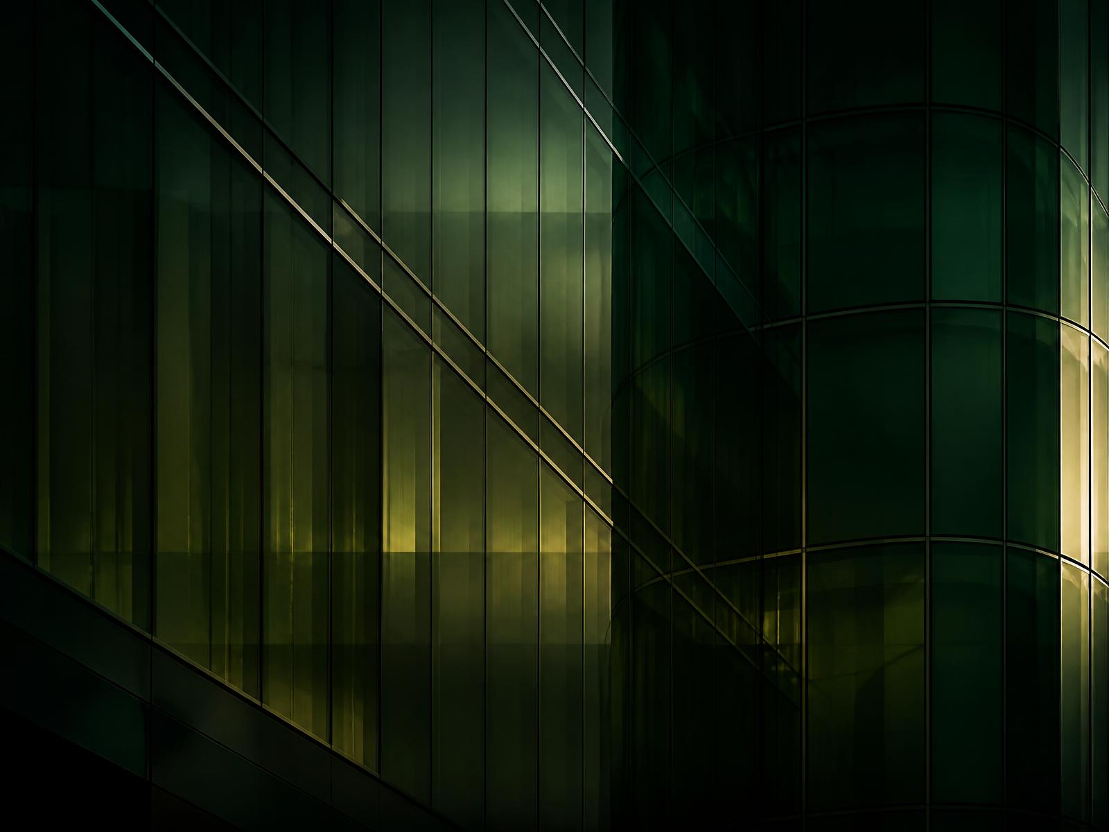 Institutional glass facade at dusk